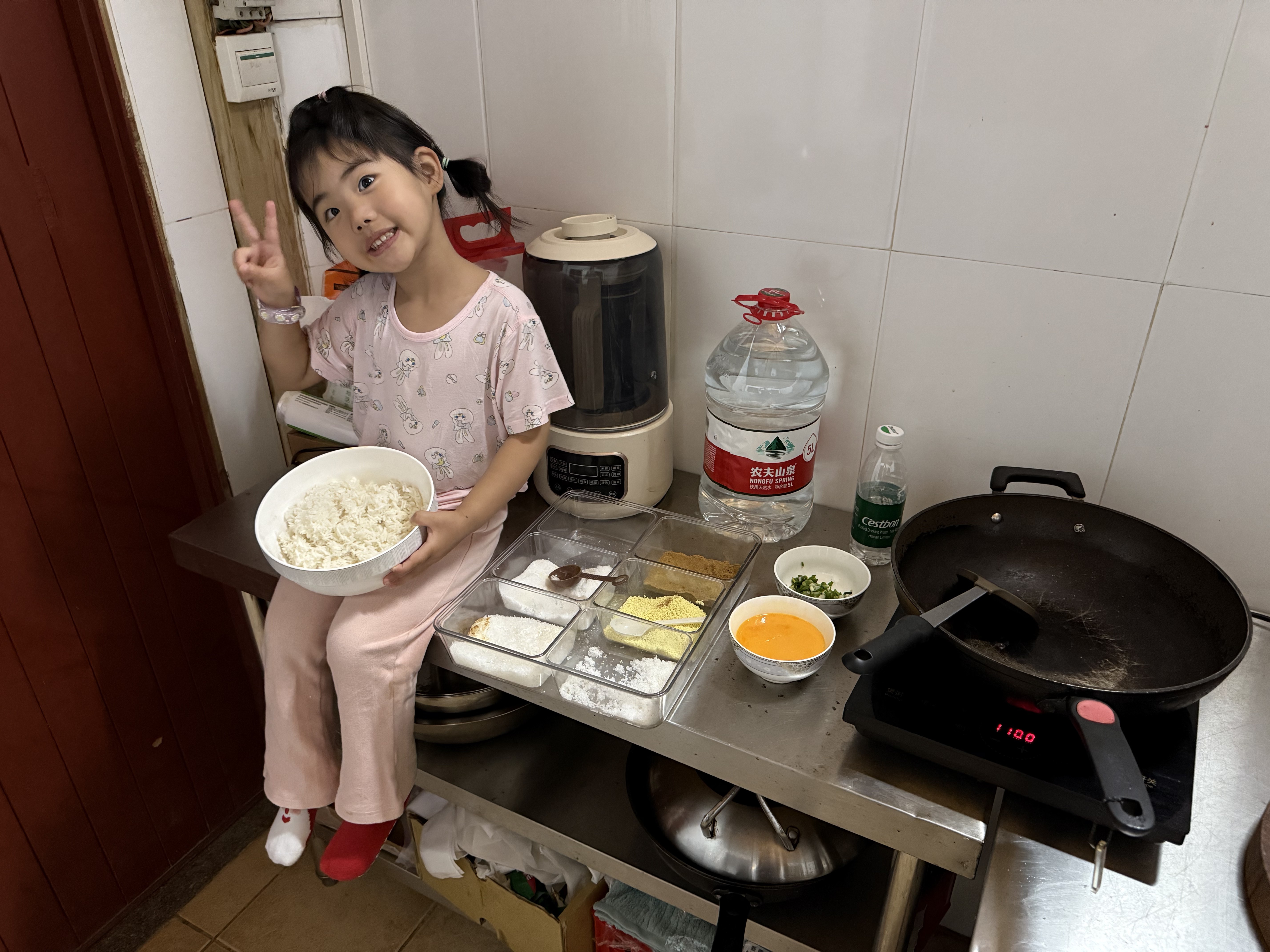 Two girls folding dumplings