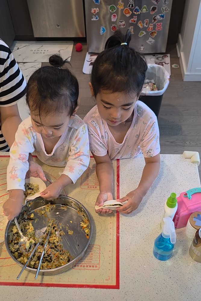 Toddler pressing dough