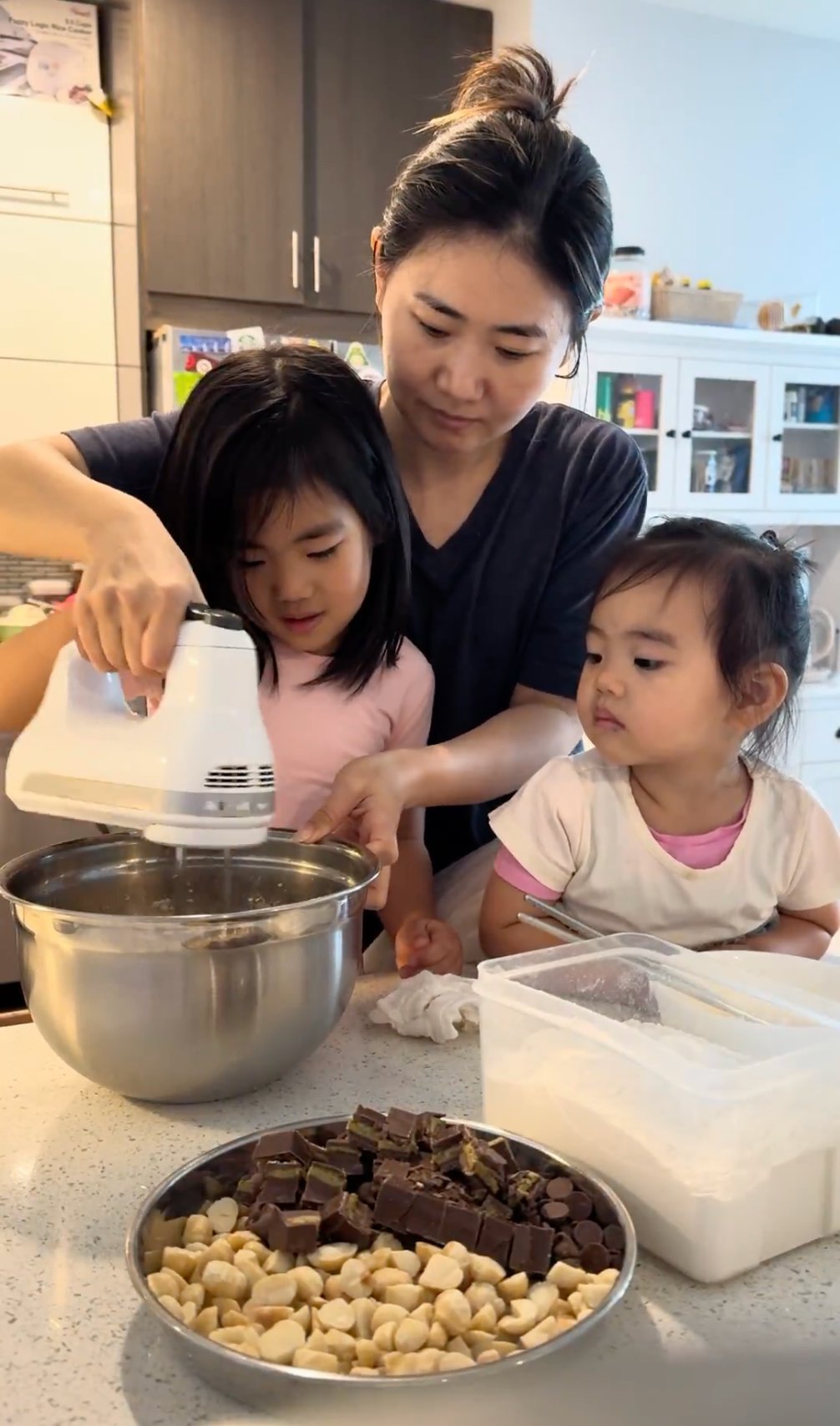 Two girls shelling beans